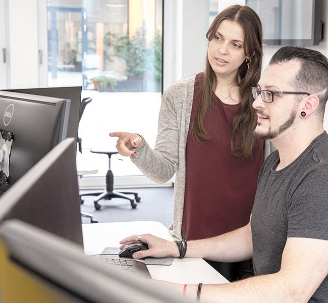 two workers at desk